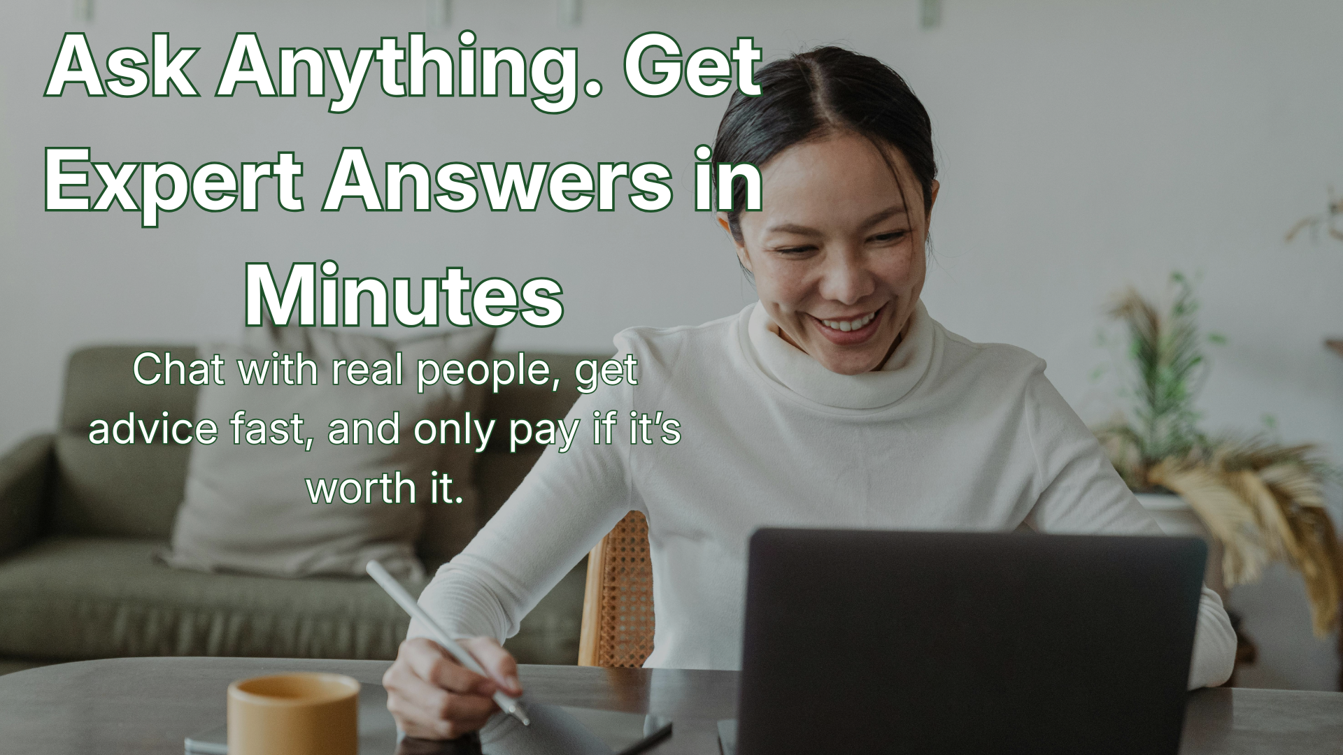 A person smiling while talking with an expert on a laptop